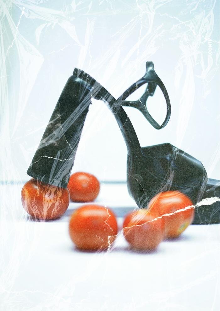 Sculptural heel on cherry tomatoes under plastic
